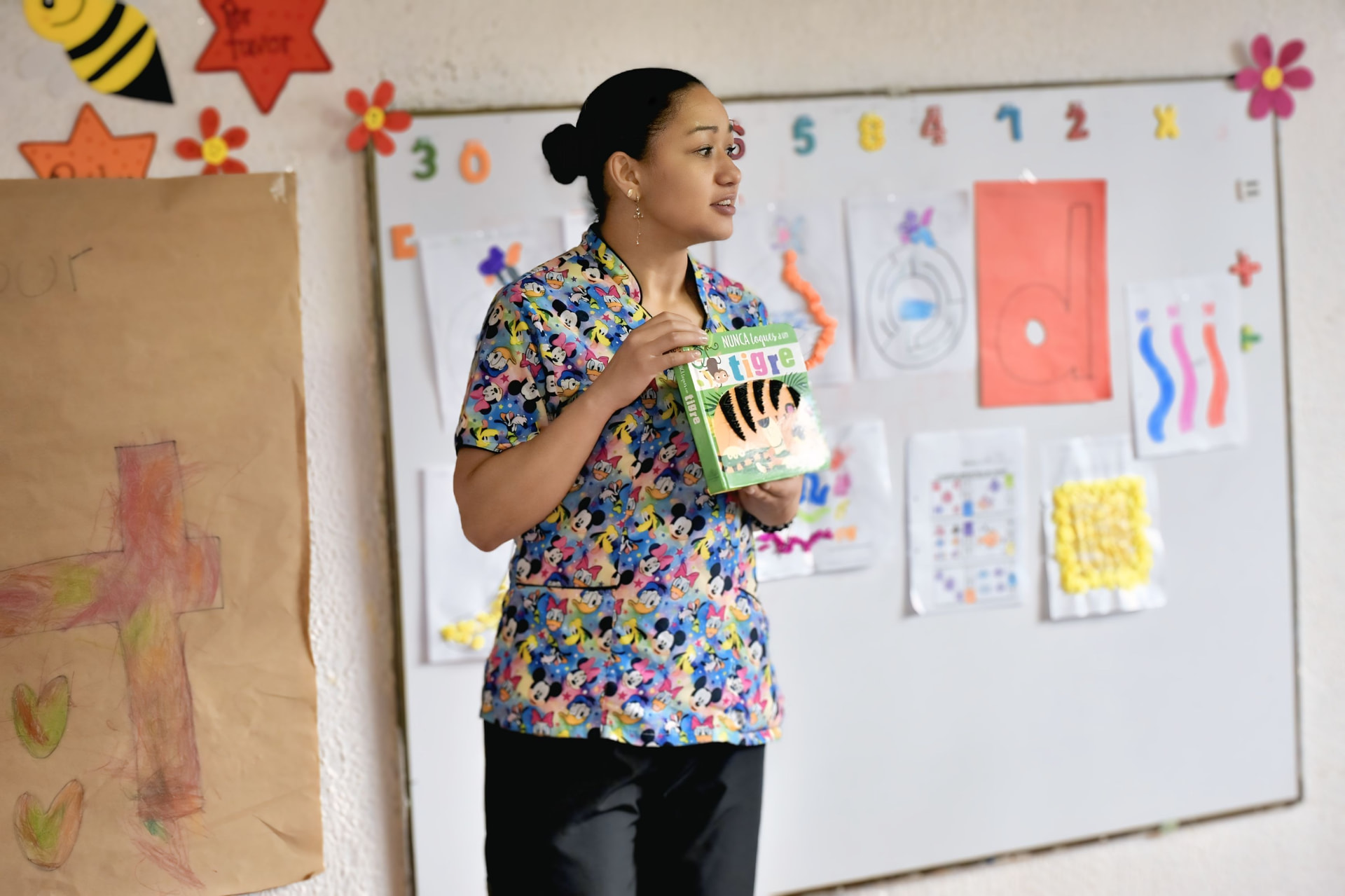 A teacher reading a picture book aloud to her class